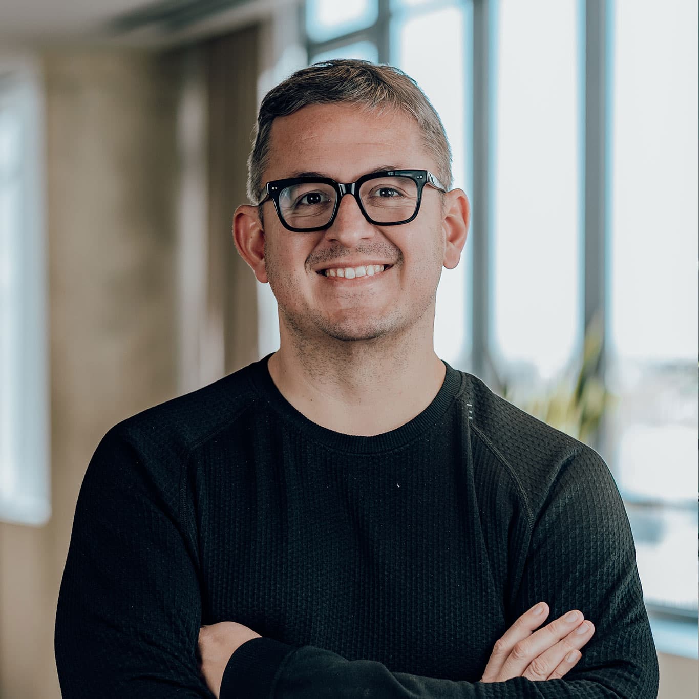 Casey Meraz, founder of Ethical Digital Marketing, smiling in a bright Kinsale office